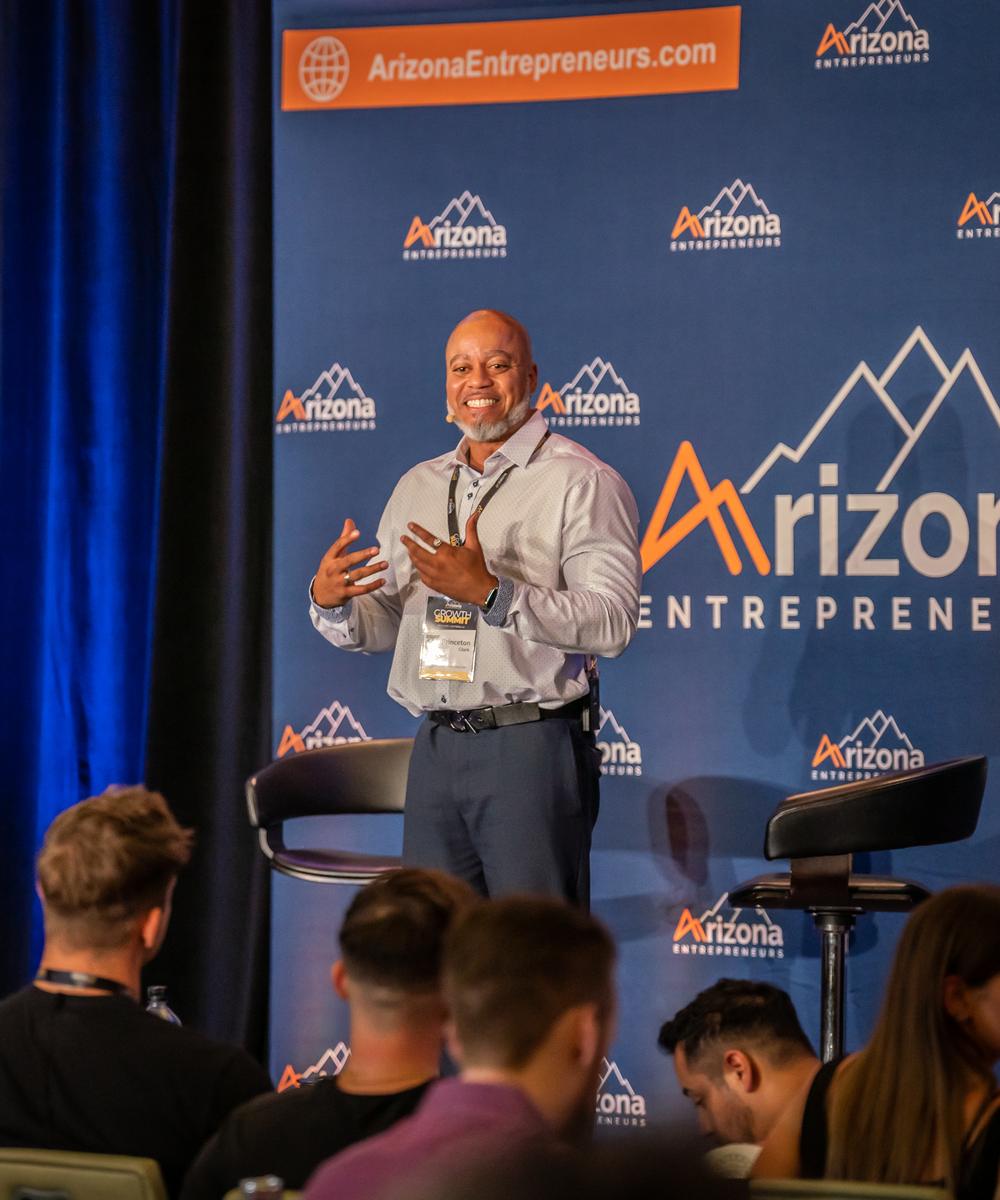 Princeton Clark speaking on stage